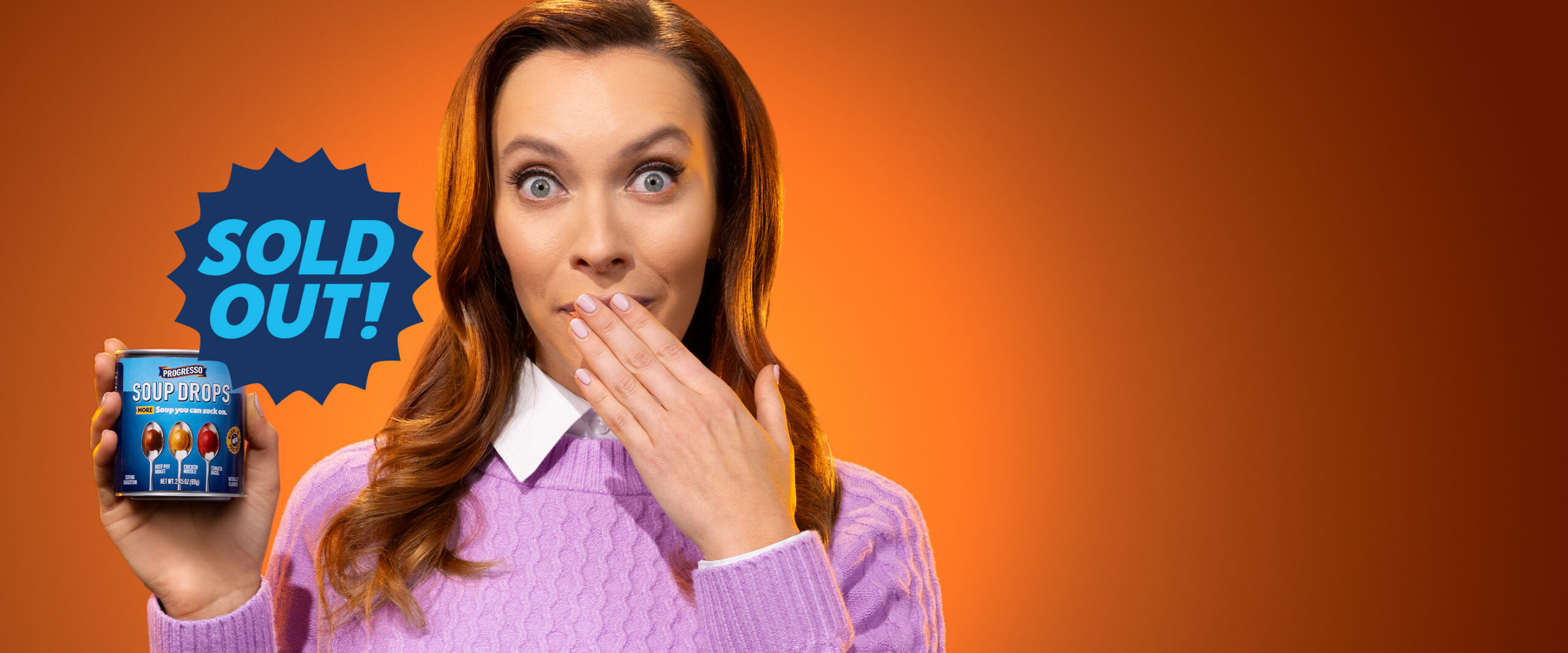 Sold out. A woman holding a can of soupdrops.